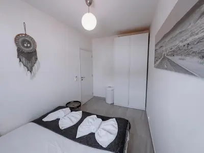 a bedroom with a bed with two white towels at Viking Family Superior Lux in Ayia Napa