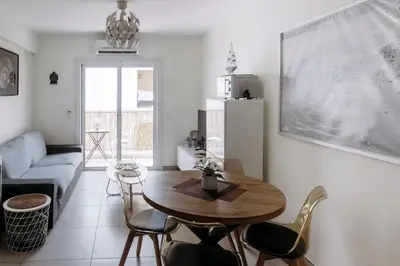 a living room with a table and chairs and a couch at Viking Family Superior Lux in Ayia Napa