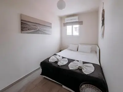 a bedroom with a bed with bows on it at Viking Family Superior Lux in Ayia Napa