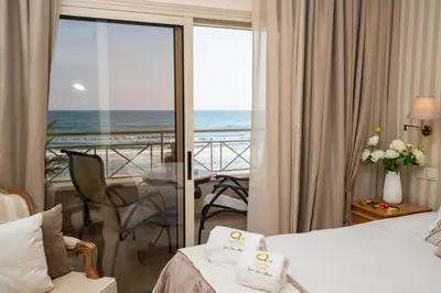 a hotel room with a view of the ocean at Quattro Beachfront Sea View Ap 4 in Larnaka
