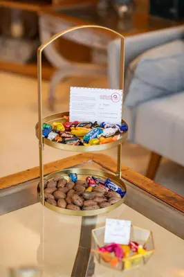 a table with two plates of food on a shelf at Quattro Beachfront Sea View Ap 4 in Larnaka