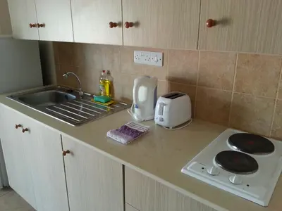 a kitchen counter with a sink and a toaster at St. Lazaros House in Larnaka