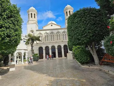 a large white building with two towers on top of it at Chariandry Residence, Limassol City Centre in Limassol