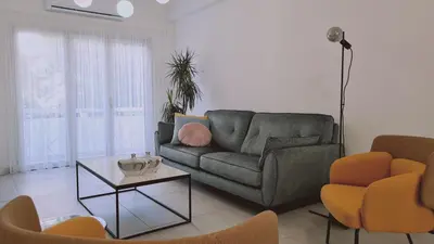 a living room with a couch and two chairs at STAY Vital Elegance in Limassol