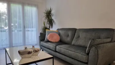 a living room with a couch and a table at STAY Vital Elegance in Limassol
