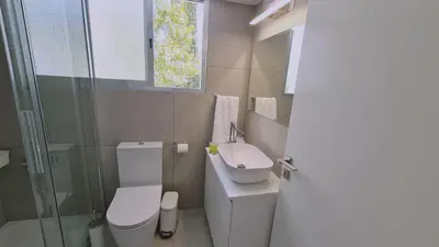 a small bathroom with a toilet and a sink at STAY Vital Elegance in Limassol