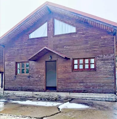 a wooden building with a door on it at The Mouflon House Pedoulas in Nicosia