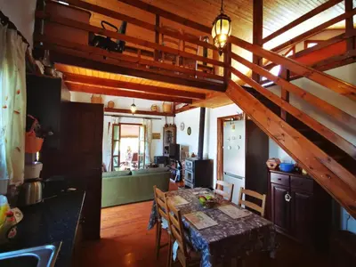 a kitchen and dining room with a table in a room at The Mouflon House Pedoulas in Nicosia