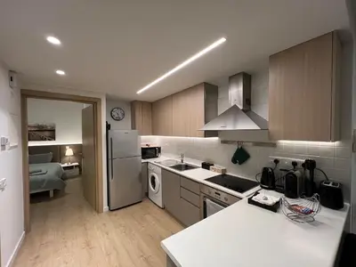 a kitchen with a refrigerator and a stove top oven at Daniela's modern apartment in Strovolos