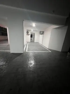 an empty room with a white wall and a tile floor at Natali's luxury apartment in Strovolos