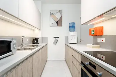 a kitchen with a sink and a microwave at Anchora in Paralimni