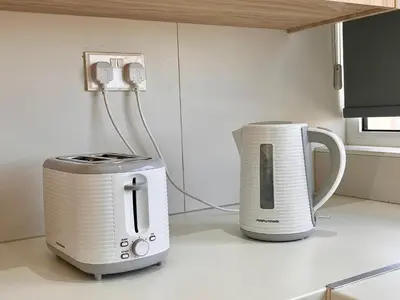 two toasters sitting on a counter in a kitchen at Larnaca BeachHouse in Larnaka