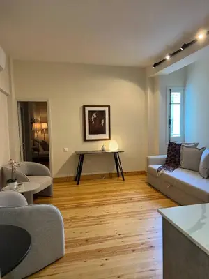 a living room with a couch and a table at Nicosia City Centre Luxury Renovated Apartment in Nicosia