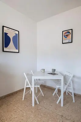 a white table and chairs in a room at Urban Condo 10 - 2 Bdr in Nicosia