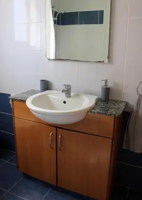 a bathroom with a sink and a mirror at Raise Limassol Urban Escape in Limassol