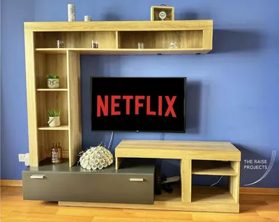 a tv sitting on a tv stand in a living room at Raise Limassol Urban Escape in Limassol