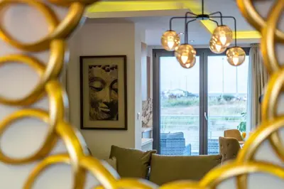 a living room with a couch and a window at Stavri De'Lux Apartment in Larnaka