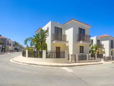 a house on the side of a street at Fotini Villas in Protaras