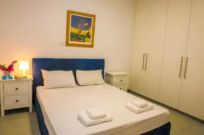 a bedroom with a bed with two towels on it at Luxury Stay in Engomi