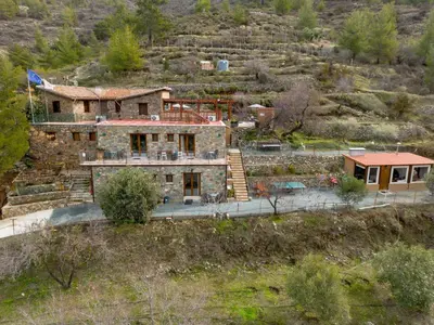 an aerial view of a house in a field at Fikardou Chalets in Phikardhou
