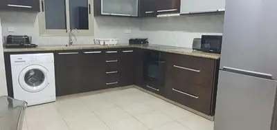 a kitchen with a washing machine and a washer at BLUE LUXURY APARTMENT (BREAKBOOKING CY-SERVICES LTD) in Limassol