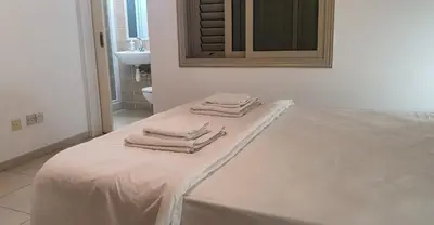 three towels sitting on a bed in a bathroom at BLUE LUXURY APARTMENT (BREAKBOOKING CY-SERVICES LTD) in Limassol