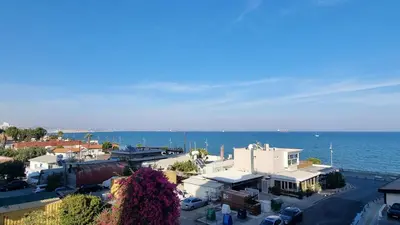 an aerial view of a small town next to the ocean at Stylish Beach Apt w/ Sea View + Pool + 200Mbit in Larnaka