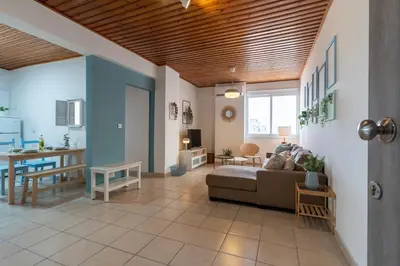 a living room with a couch and a table at Laurel 2-Bedroom Apartment in Larnaca in Larnaka