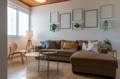a living room with a couch and a table at Laurel 2-Bedroom Apartment in Larnaca in Larnaka
