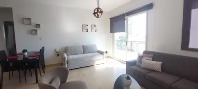 a living room with a couch and a table at Limassol Star 21 in Limassol