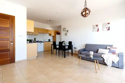 a living room with a couch and a table at Limassol Star 21 in Limassol