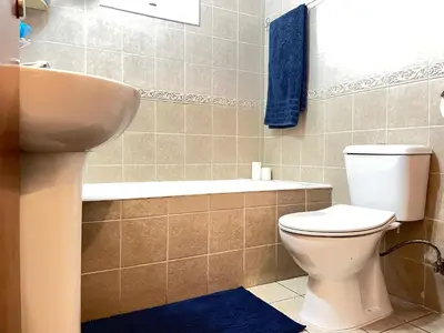a bathroom with a toilet and a sink at Anastasia Holiday Apartment Larnaca in Larnaka