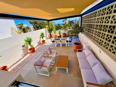 a balcony with purple furniture and a table and chairs at Bridge House 201 - 3BR Penthouse in Limassol