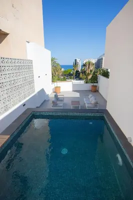 a swimming pool on the roof of a building at Bridge House 201 - 3BR Penthouse in Limassol