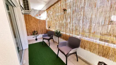 a waiting room with chairs and a green carpet at Center 2Br Apt w/ parking and 250m walk from beach in Larnaka