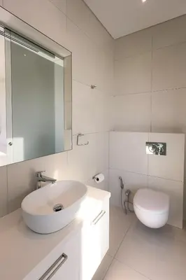 a white bathroom with a sink and a toilet at City Napa Seaview Villas - Villa 8 in Ayia Napa