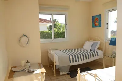 a small room with a bed and a window at Villa Niki in Ayia Napa