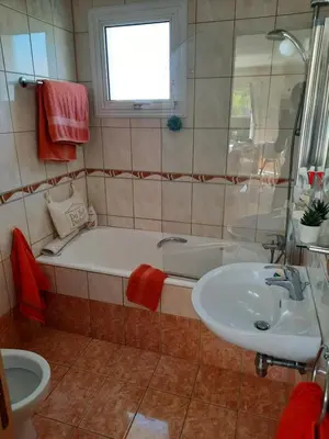 a bathroom with a tub and a sink at Villa Niki in Ayia Napa
