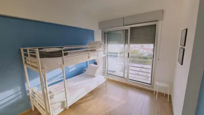 a room with two bunk beds and a window at STAY Mystique Apartment in Limassol