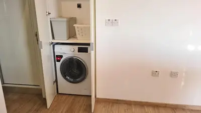 a laundry room with a washer and dryer at STAY Mystique Apartment in Limassol