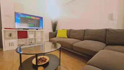 a living room with a couch and a glass table at STAY Mystique Apartment in Limassol