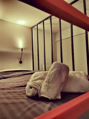 a hotel room with a bed with a blanket at Unique City Centre Apartments in Nicosia