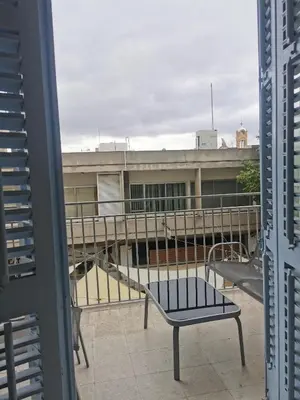 a bench on the balcony of a building at Unique City Centre Apartments in Nicosia