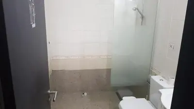 a small bathroom with a toilet and a sink at 2br-7 Guests-Free Parking-Pool-AirCon in Paralimni