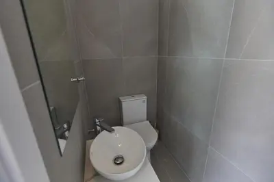 a small bathroom with a toilet and a mirror at Protaras Elite Pearl Villa Ep4b in Protaras