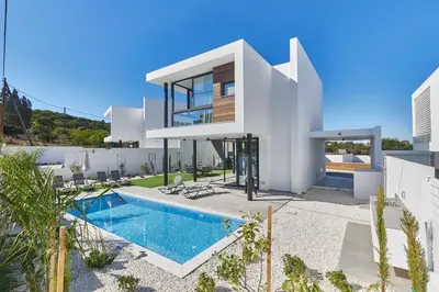 a villa with a swimming pool and a house at Protaras Elite Pearl Villa Ep4b in Protaras