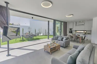 a living room with a couch and a table at Protaras Elite Pearl Villa Ep4b in Protaras