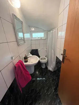 a bathroom with a toilet and a sink at Μοναδικό δωμάτιο in Limassol