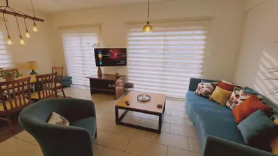 a living room with a couch and chairs and a table at STAY Naturaleza Penthouse in Limassol