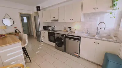 a kitchen with a sink and a dishwasher at STAY Naturaleza Penthouse in Limassol